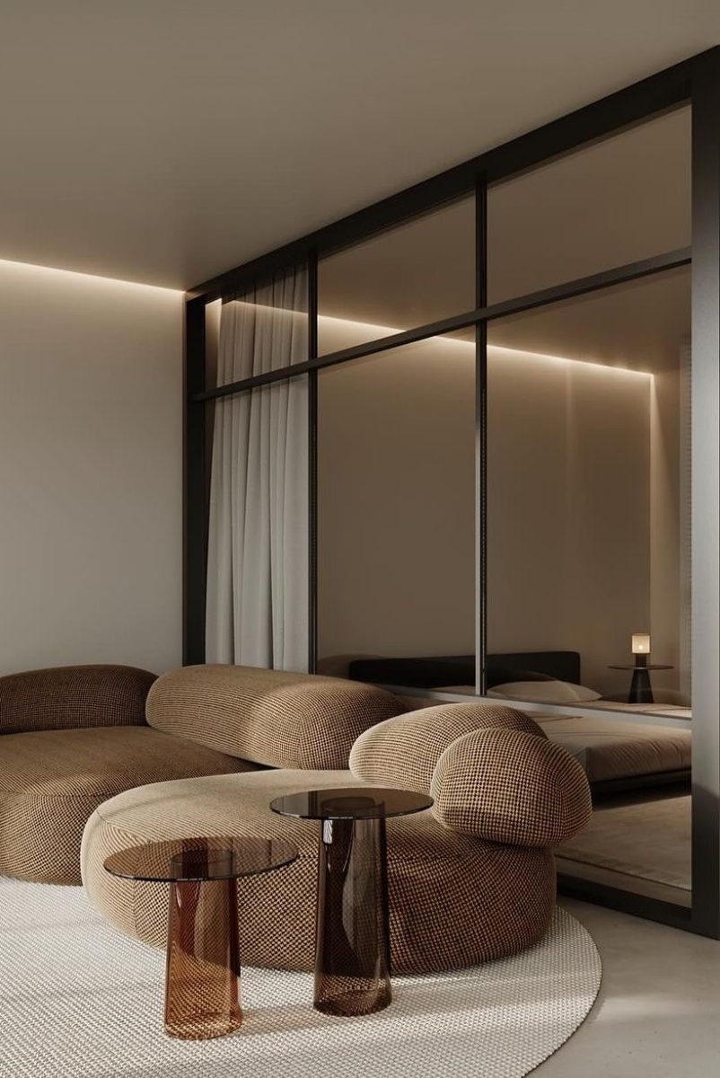 Living room with a curved boucle sofa and round side tables